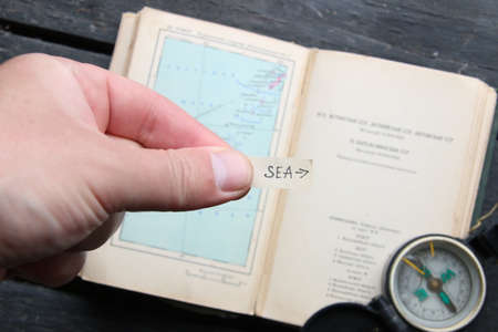 Pointer to the sea on a background of satin. Summer tourism concept.の写真素材