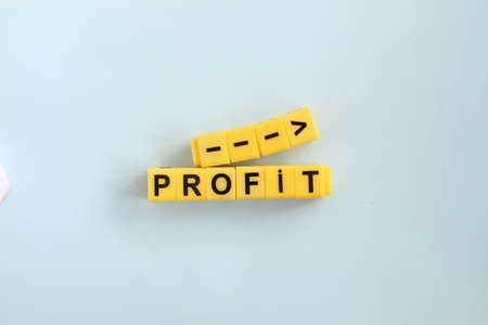 Profit growth concept. The inscription in yellow letters on a blue background.の写真素材