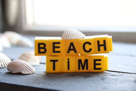 beach time creative concept yellow lettering letteringの写真素材