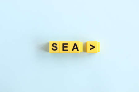 pointer to the sea, inscription in yellow letters on a blue backgroundの写真素材
