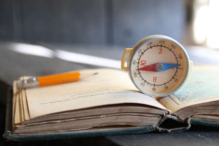 Magnetic compass on world map. Adventure, discovery, navigation, communication, logistics, geography conceptの写真素材