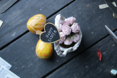 happy easter concept, basket of flowers and letteringの写真素材
