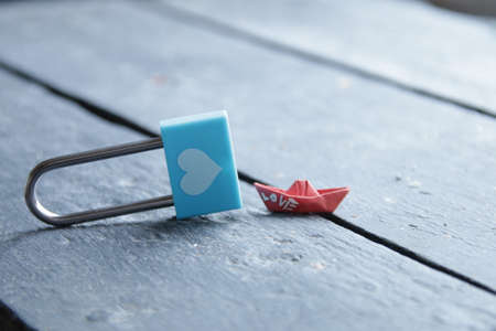 Love or Valentine's day idea. Blue padlock with heart on vintage background.の写真素材
