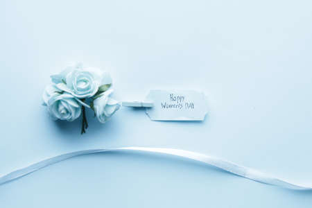 Happy Womens Day concept. The inscription on a blue label on a blue background.の写真素材