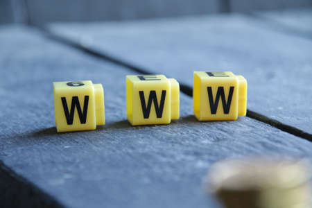 www text. Yellow letters on vintage background. Internet concept.の写真素材