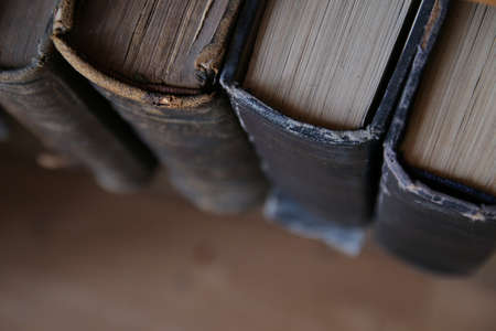 Vintage books on the shelf in the library. Education background.の写真素材