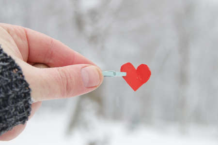 Creative winter background with blue paper heart.の写真素材
