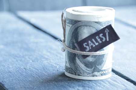 Sales growth idea. Money and tag. Successful business concept.の写真素材
