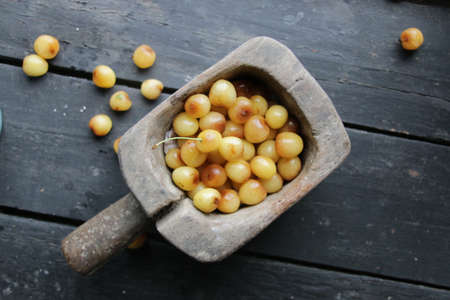 Fresh cherries on a vintage table. Healthly food.の写真素材