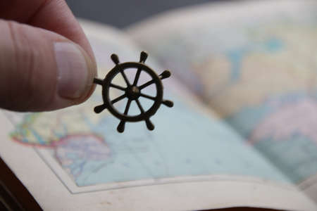 Vacation at sea concept. Hand holds the steering wheel.の写真素材