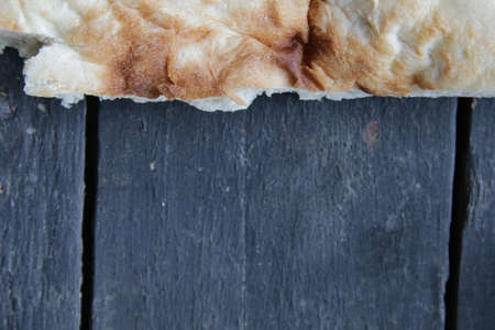 Background for the menu. Georgian bread lavash on dark rustic backgroundの写真素材