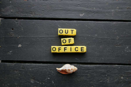 Out of office. High quality photo. Lettering made from yellow cubes.の写真素材