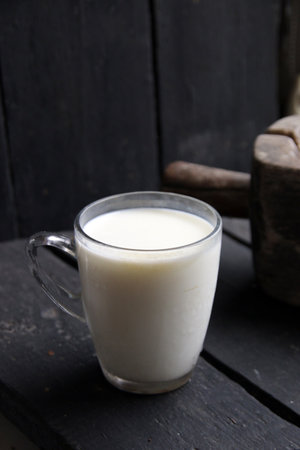 Glass of milk on a beautiful vintage background.の写真素材