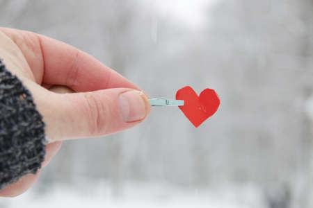 Creative winter background with blue paper heart.の写真素材