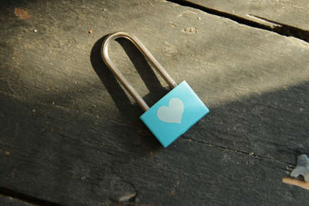 Valentine card. Blue padlock with white heart pattern.の写真素材