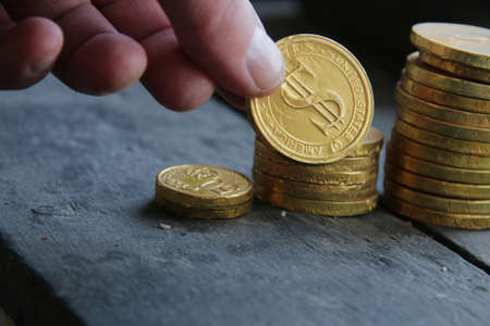 Profit growth, business concept. Chart profit from gold coins.の写真素材