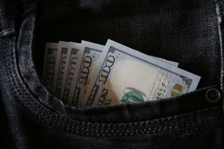 Hundred dollar bills in jeans pocket, business concept.の写真素材