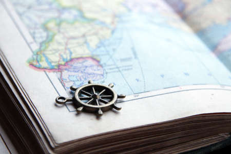 Summer travel idea. Smoll nautical steering wheel and map.の写真素材