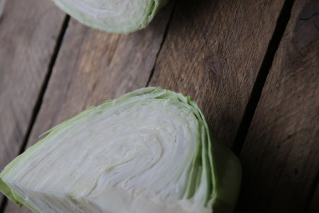 Fresh green cabbage on wooden background. top view.の写真素材