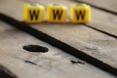Text Www. Yellow letters on vintage background. internet concept.の写真素材
