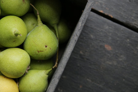 Ripe juicy pears in a vintage box.の写真素材