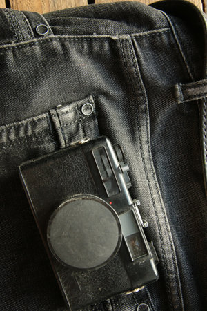 Beautiful retro camera on a black background.の写真素材