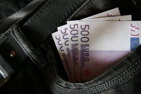 Money in jeans pocket, creative idea.の写真素材