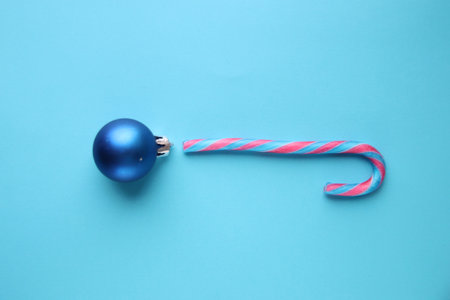 Merry christmas creative card. Candy cane and Christmas Bauble.の写真素材