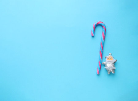Merry christmas creative card. Santa Claus and candy cane.の写真素材