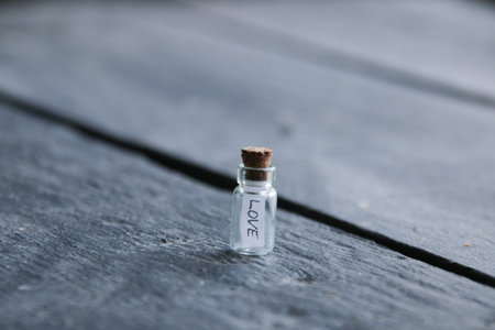 love concept. A bottle with the inscription love. vintage style.の写真素材