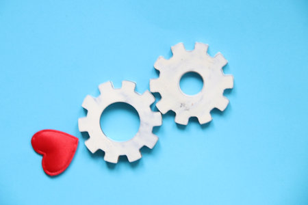 Gears on blue background. Teamwork, partnership, business, cooperation and management idea.の写真素材