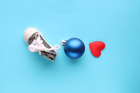 Merry christmas creative card. Christmas bauble and heart.の写真素材