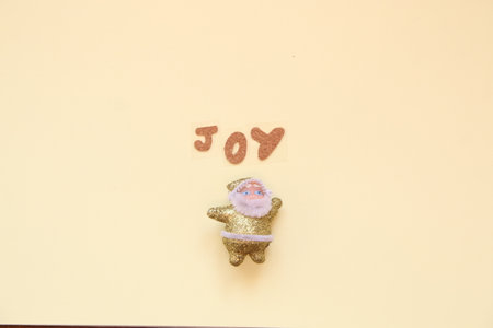 joy concept. Inscription and Santa Claus on a yellow background.の写真素材