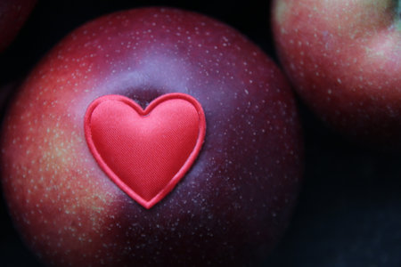 Healthy food idea. Red heart on ripe red apples, healthy food idea.の写真素材
