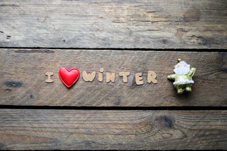 I love winter, inscription on a wooden table. creative concept.