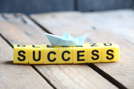 Success creative concept. Lettering from yellow cubes.の写真素材