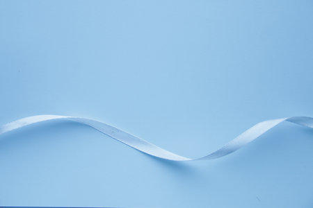 blue background. Blue ribbon on a blue background. background for a card.の写真素材