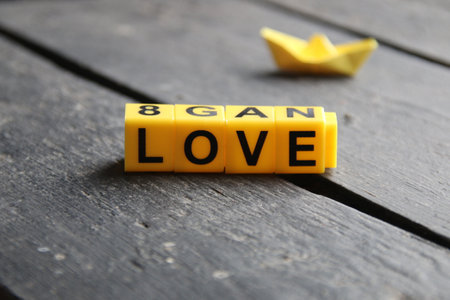 Love creative concept, inscription on yellow cubes.の写真素材