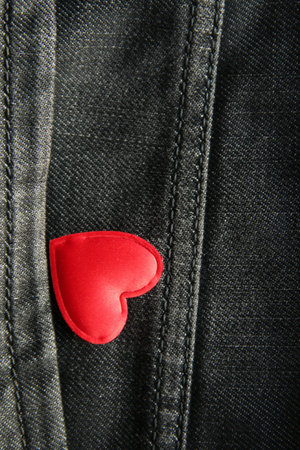Valentine card, creative concept. Red heart in jeans pocket.の写真素材
