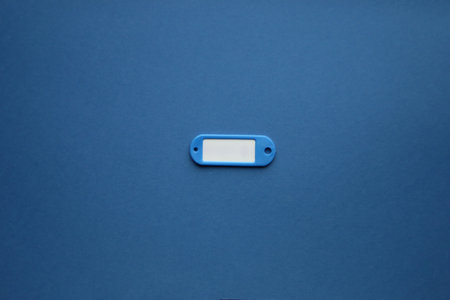 Tag with place for text on a blue background. advertising background.の写真素材