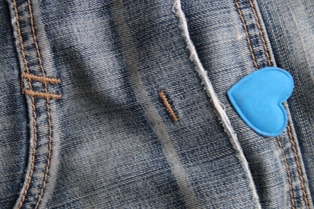 Blue heart on jeans. Creative birthday background.の写真素材