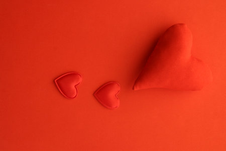 Valentine's Day background. Red heart on a red background.の写真素材