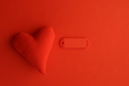 Valentine's Day background. Red heart on a red background. Or a happy birthday card.