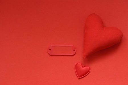 Valentine's Day background. Red heart on a red background. Or a happy birthday card.の写真素材