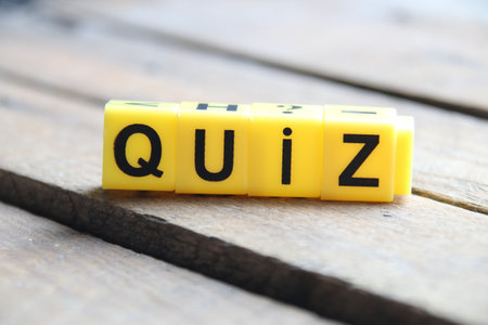 Quiz idea. Written on a yellow cubes.の写真素材