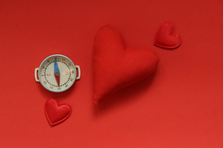 Valentines day background with red heart and compass.の写真素材