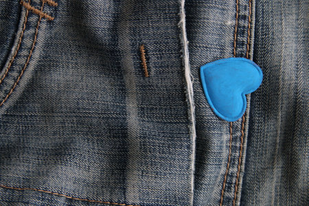 Blue heart on jeans. Creative birthday background.の写真素材