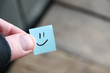 Smiley face on old wooden background, copy space.の写真素材