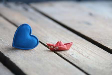 Blue heart on a wooden background. Place for text. summertime.の写真素材