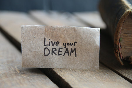Live your dream card. The inscription on the tag. vintage style. Motivational quotes.の写真素材